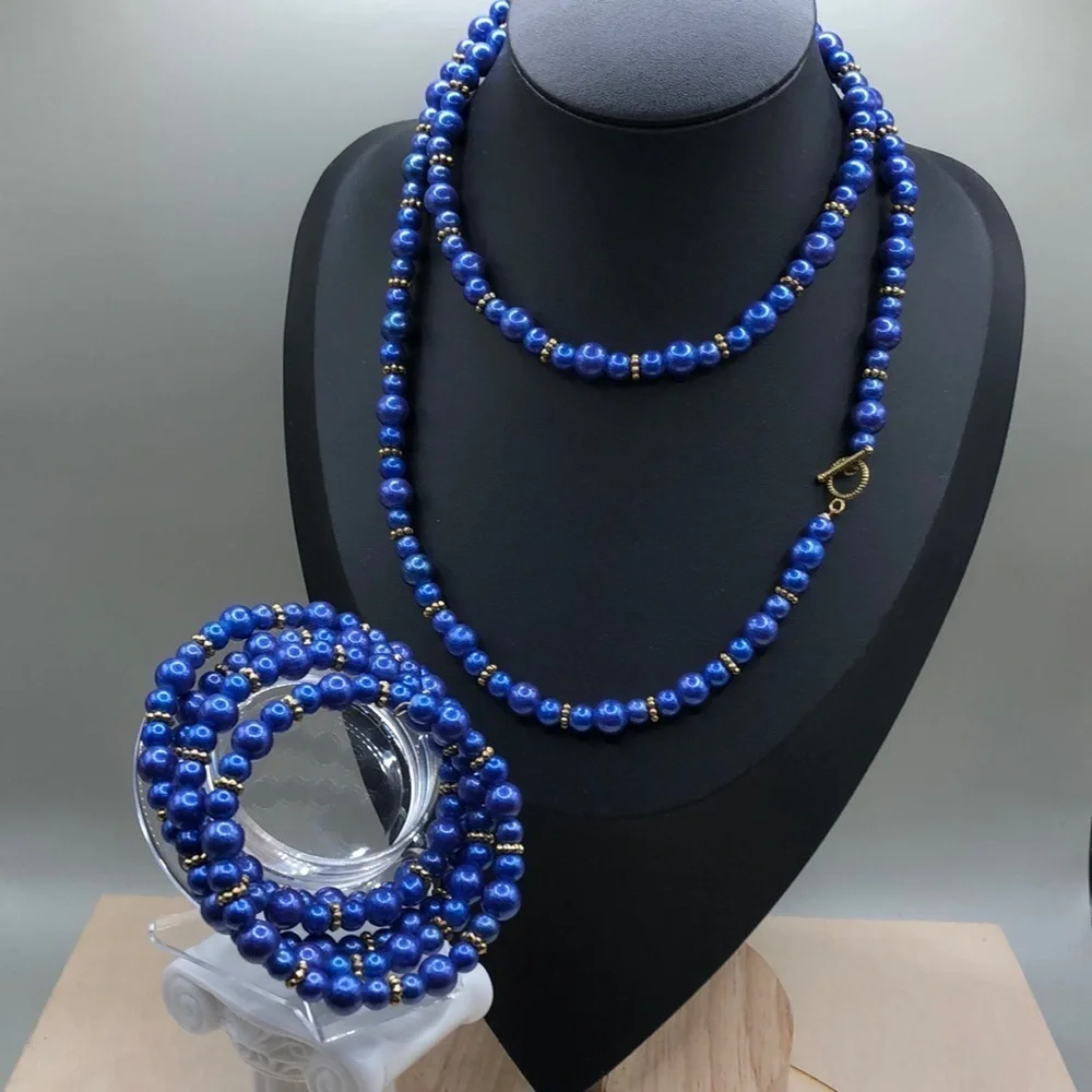 Vintage artisan jewelry set beaded necklace and bracelet statement style look.